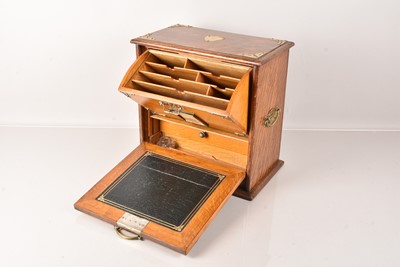 Lot 125 - A mahogany and brass travel desk and tidy