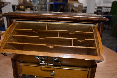 Lot 125 - A mahogany and brass travel desk and tidy