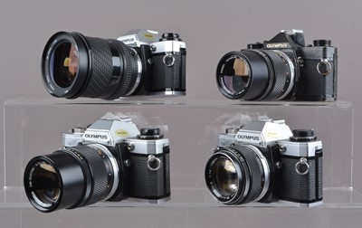 Lot 244 - Four Olympus OM SLR Cameras