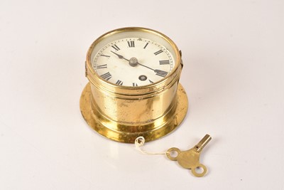 Lot 716 - A small Brass Bulkhead Clock