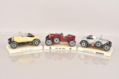 Lot 836 - Three Carton Ware Ceramic Car Models