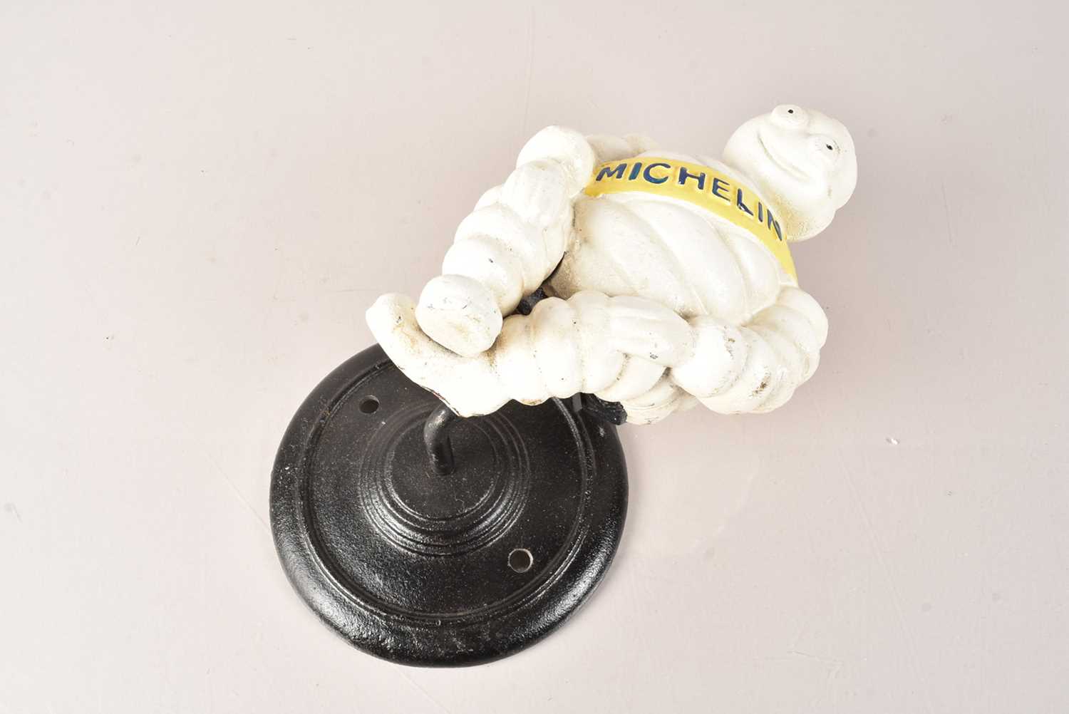 Lot 873 - A Cast Iron Michelin Man Wall Mount