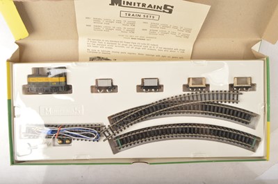 Lot 83 - Three Minitrains HOn30 Narrow Gauge Train Sets, small Display Cases Bachmann Locomotion Display Model and Replicars mini Kit and HO Gauge Platform packaging accessories (qty)