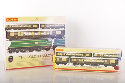 Lot 278 - Hornby (China) R2369 "The Golden Arrow" Train and coach packs, (2)