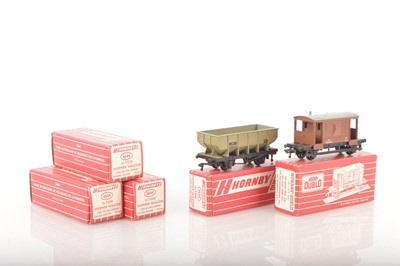 Lot 330 - Four Hornby-Dublo 00 Gauge 2-Rail Boxed late issue 4644 21-Ton Hopper Wagons and 4311 Brake Van (5)