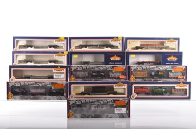 Lot 386 - Five Bachmann boxed 00 Gauge Tank wagon triple packs and various bogie well and Bolster wagons (12 boxes, 23 wagons)