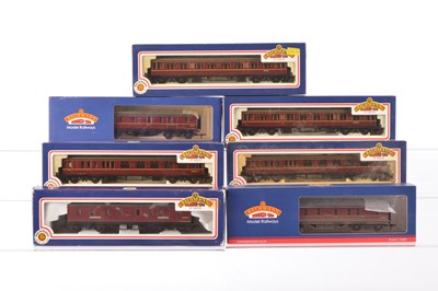 Lot 392 - Four Bachmann boxed 00 Gauge BR maroon Collett 60' coaches and three Parcels Vans (7)