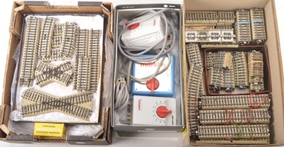 Lot 726 - A large Collection of Marklin HO Gauge 3-rail (stud) Track and Power Units (qty)