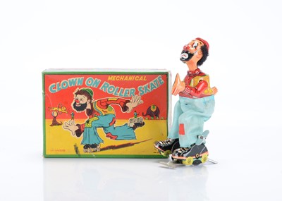 Lot 424 - A T.P.S Toplay Ltd (Japan) Tinplate Clockwork Clown On Roller Skate