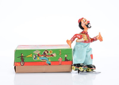 Lot 424 - A T.P.S Toplay Ltd (Japan) Tinplate Clockwork Clown On Roller Skate