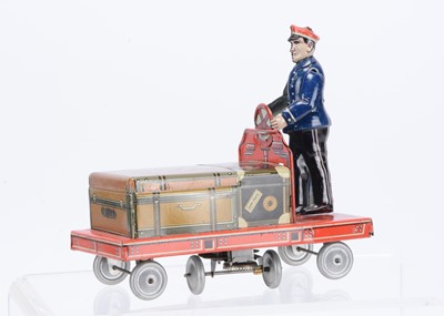 Lot 434 - A Hammerer & Külhwein (U.S Zone Germany) Tinplate Clockwork Railway Porter