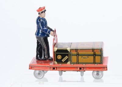 Lot 434 - A Hammerer & Külhwein (U.S Zone Germany) Tinplate Clockwork Railway Porter