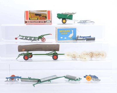 Lot 560 - Britains mainly post WW2 Farm implements and vehicles comprising boxed 135F Disc Harrow (box missing one end)