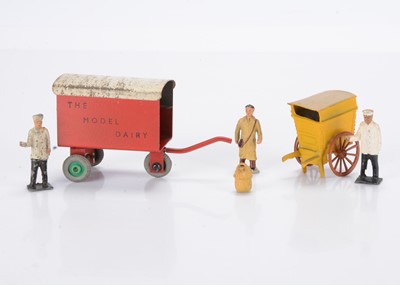 Lot 572 - Unusual hand-drawn carts by Taylor & Barrett and Charbens comprising post WW2 T & B lead bakers cart with baker and basket