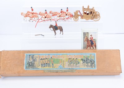 Lot 636 - Boxed Timpo Coronation Coach and H M The Queen Lizzie II comprising coach with reins, horse and riders