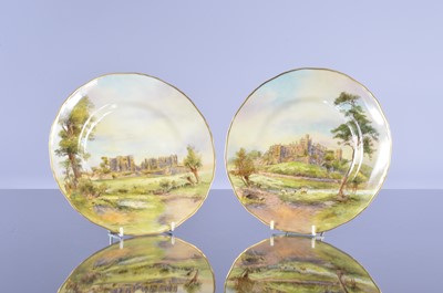 Lot 15 - A pair of Royal Worcester hand painted porcelain plates by D. Wilson