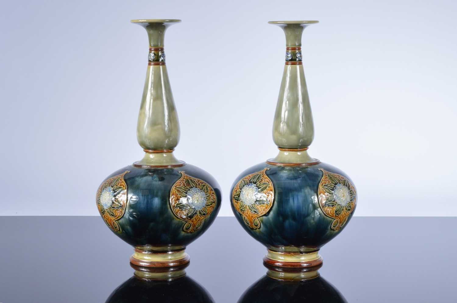 Lot 23 - A large pair of late Victorian Royal Doulton stoneware vases