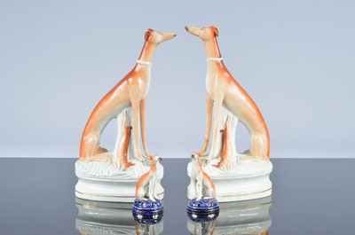 Lot 33 - Two pairs of Victorian Staffordshire pottery greyhounds