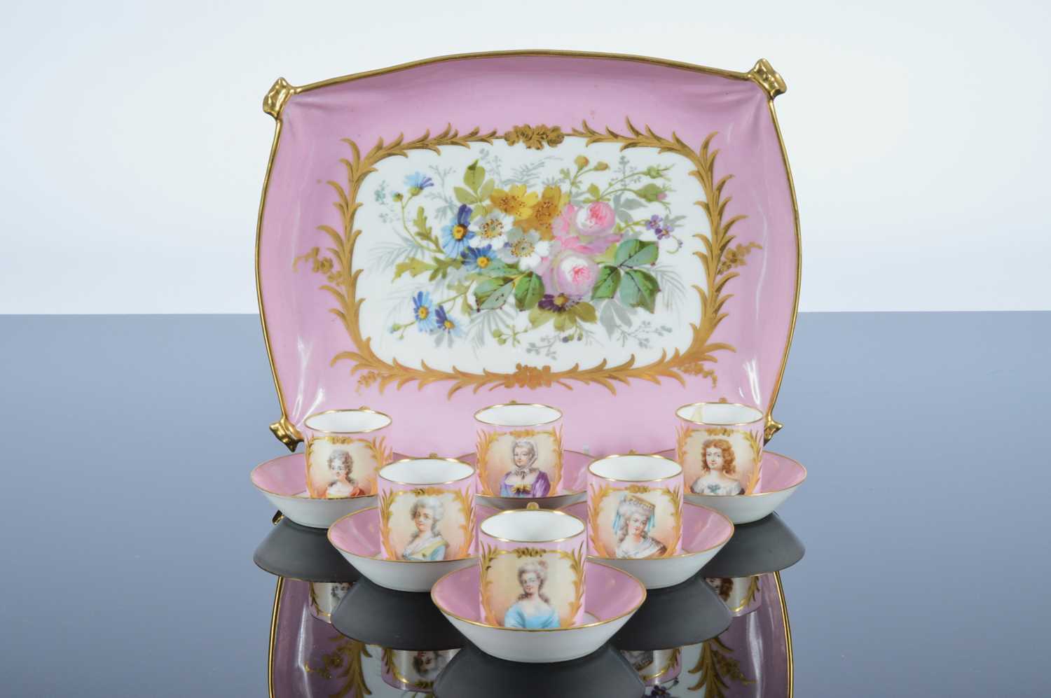 Lot 56 - A pretty French porcelain cabinet coffee cup and saucer set with tray