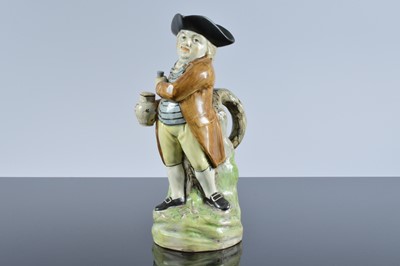 Lot 123 - An early 19th century Pearlware pottery figural jug