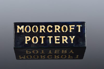 Lot 149 - A Moorcroft Pottery triangular retail sign