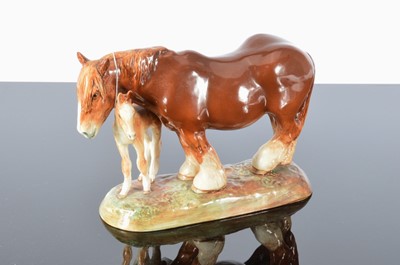 Lot 168 - A Royal Doulton shire horse and foal group