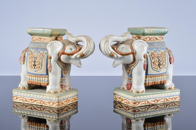 Lot 196 - A pair of mid 20th century earthenware elephant stands