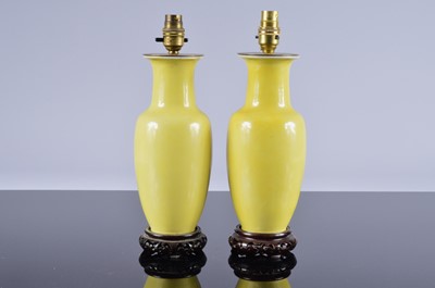 Lot 202 - A pair of mid 20th century Chinese yellow porcelain lamp bases