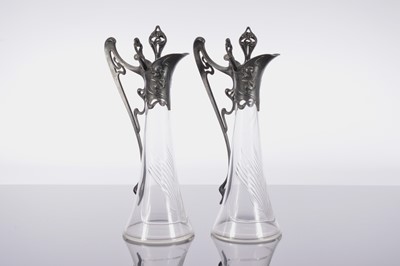 Lot 223 - A pair of Art Nouveau glass and pewter ewers