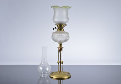 Lot 245 - An Arts & Crafts brass and cut glass oil lamp