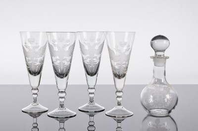 Lot 257 - A set of four Russian glass Champagne flutes and a decanter