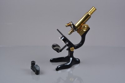 Lot 622 - A mid-20th Century lacquered brass and black-enamelled Leitz Student Microscope