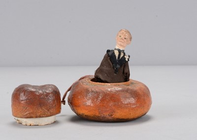 Lot 20 - A papier-mâché novelty cottage loaf with pop-up Joseph Chamberlain, circa 1905