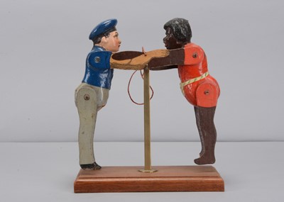 Lot 34 - An Albin Amende Sonneberg German navy sailor from the SMS Eber and black man wresting toy, circa 1888