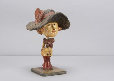 Lot 38 - An 1870s Thüringen women with outsized head and hat nodder