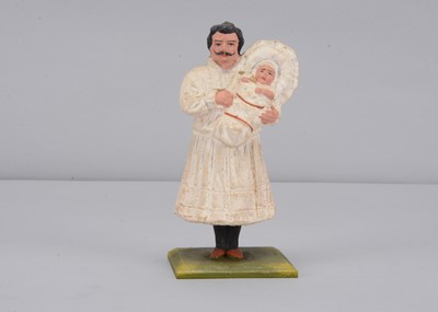 Lot 41 - A late 19th century Thüringen anti-Suffragette father holding the baby wearing a dress swayer