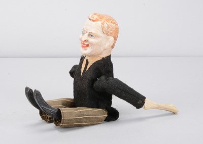 Lot 45 - An early 20th century German composition headed Joseph Chamberlain clockwork tumbling toy