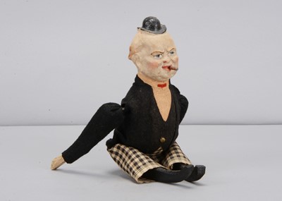 Lot 47 - An early 20th century German composition headed Winston Churchill clockwork tumbling toy