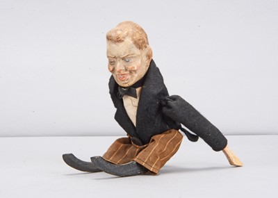 Lot 48 - An early 20th century German composition headed Joseph Chamberlain clockwork tumbling toy