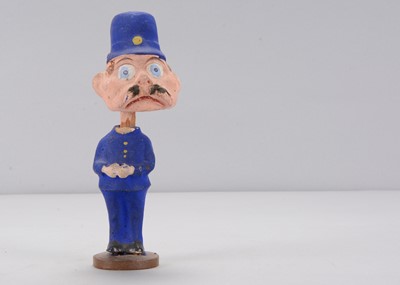 Lot 55 - An early 20th century Thüringen Palmer Cox Brownie policeman nodder