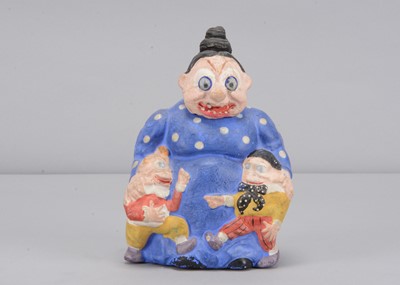 Lot 61 - A late 19th century German composition Mama Katzenjammer  candy or sweet container