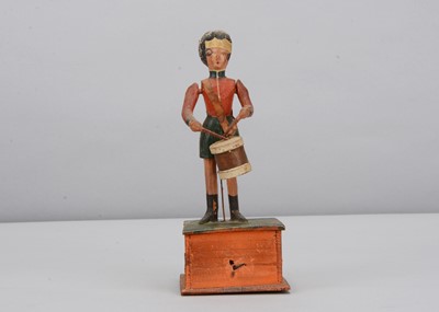 Lot 69 - A mid 19th century Thüringen composition and wood hand cranked Highlander drummer boy toy