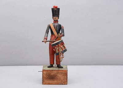 Lot 70 - A mid 19th century Thüringen composition and wood hand cranked French drummer toy