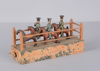 Lot 77 - A mid 19th century Erzgebirge cavalry crank toy