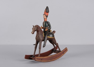 Lot 78 - A mid 19th century Thüringen composition and wood British mounted Hussar soldier rocking toy