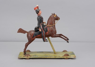 Lot 83 - A second quarter of 19th century Thüringen composition Soldier on horse pull along toy