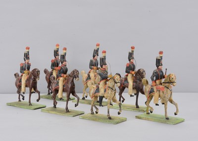 Lot 90 - Eight late 19th century German composition and wood French Napoleonic Cavalry