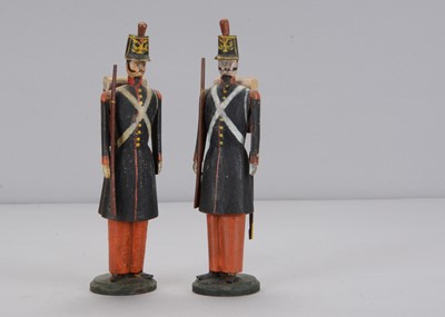 Lot 91 - A late 19th century pair of German wooden Prussian guardsmen, possibly Schneeberg area