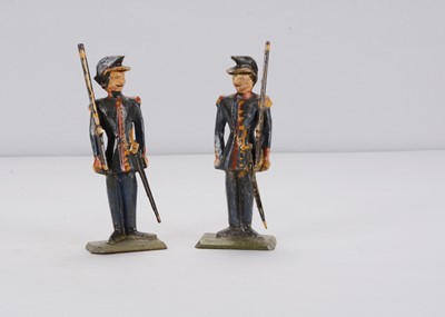 Lot 96 - Two 19th century German carved wooden infantrymen