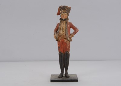 Lot 103 - A large early 19th century carved wooden Grödnertal Hussar toy soldier